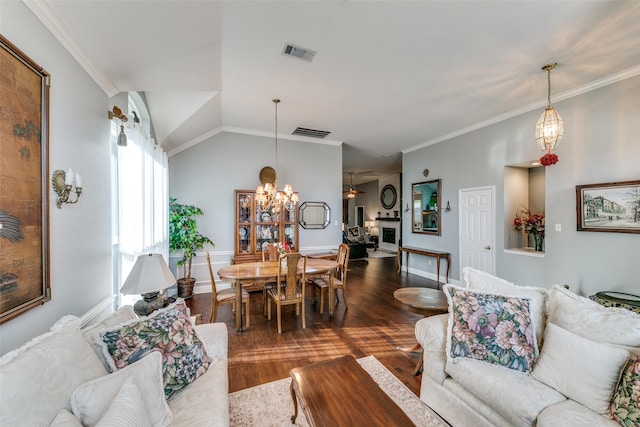209 Timberbluff Ln, Murphy, TX 75094 - living area with an inviting chandelier, ornamental molding, wood finished floors, and visible vents