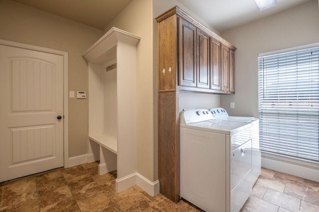 1233 War Admiral Dr, Terrell, TX 75160 - laundry room with baseboards, cabinet space, and washer and dryer