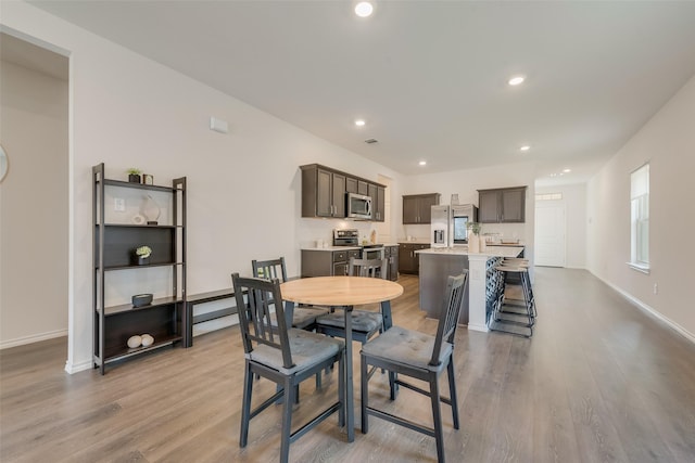 3213 Grimaldo Dr, Mesquite, TX 75126 - dining space with wood finished floors, baseboards, and recessed lighting