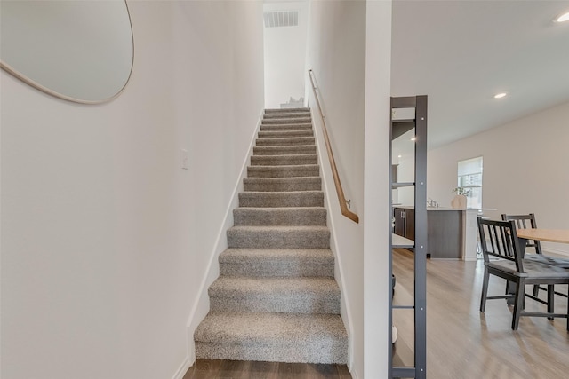 3213 Grimaldo Dr, Mesquite, TX 75126 - stairway featuring wood finished floors, baseboards, and recessed lighting