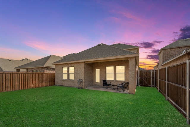 3213 Grimaldo Dr, Mesquite, TX 75126 - rear view of house featuring roof with shingles, brick siding, and a patio area