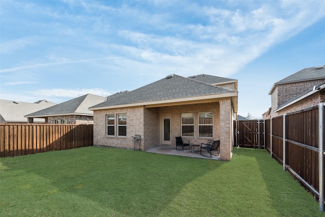 3213 Grimaldo Dr, Mesquite, TX 75126 - back of property featuring a shingled roof, brick siding, and a patio area