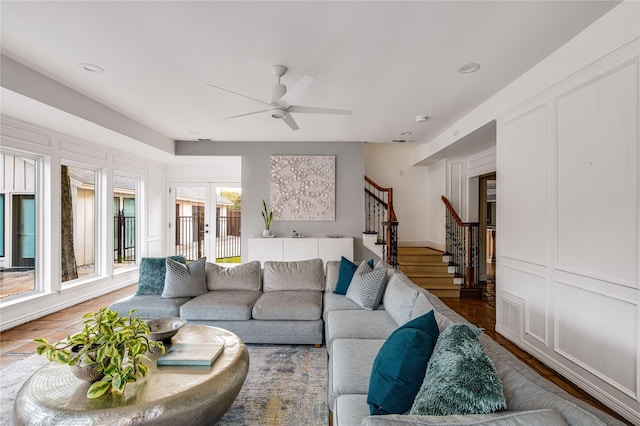 5230 Boca Raton Dr, Dallas, TX 75229 - living area featuring a decorative wall, ceiling fan, and stairway