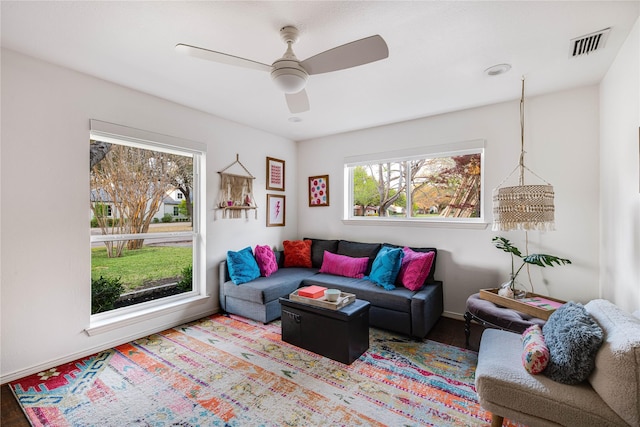 5230 Boca Raton Dr, Dallas, TX 75229 - living room featuring a ceiling fan, wood finished floors, baseboards, and visible vents