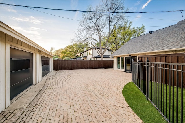 5230 Boca Raton Dr, Dallas, TX 75229 - view of patio featuring a garage and fence private yard