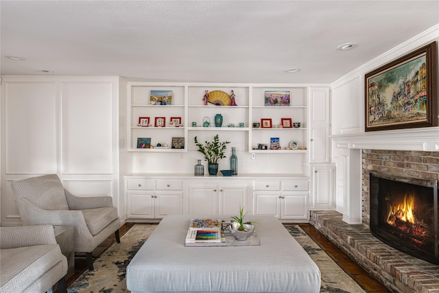 5230 Boca Raton Dr, Dallas, TX 75229 - living room with built in features, dark wood-style flooring, and a fireplace