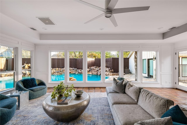 5230 Boca Raton Dr, Dallas, TX 75229 - living room featuring a decorative wall, visible vents, and ceiling fan