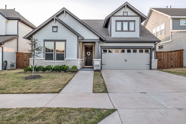 2117 Longspur Dr, Fort Worth, TX 76008 - craftsman house with stone siding, driveway, an attached garage, and roof with shingles
