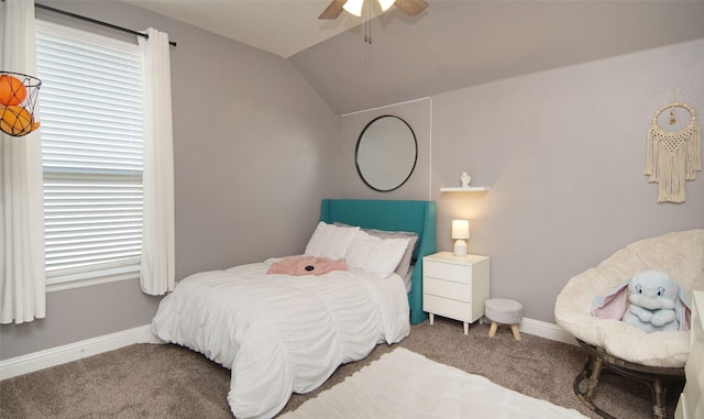 bedroom with carpet floors, baseboards, lofted ceiling, and ceiling fan