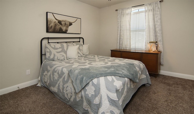 bedroom featuring baseboards and carpet flooring