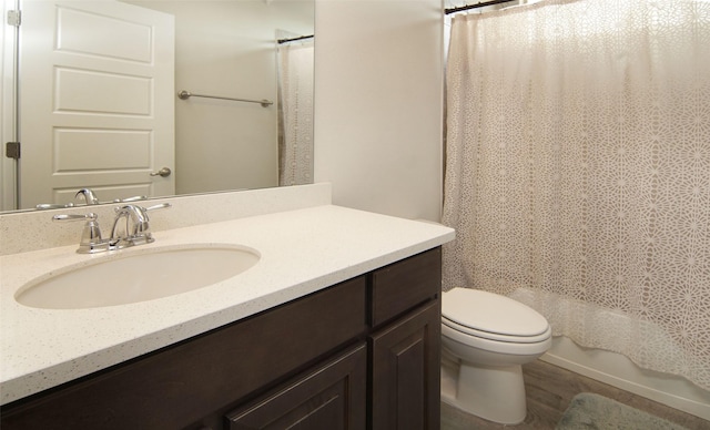 full bathroom featuring toilet, vanity, and shower / tub combo