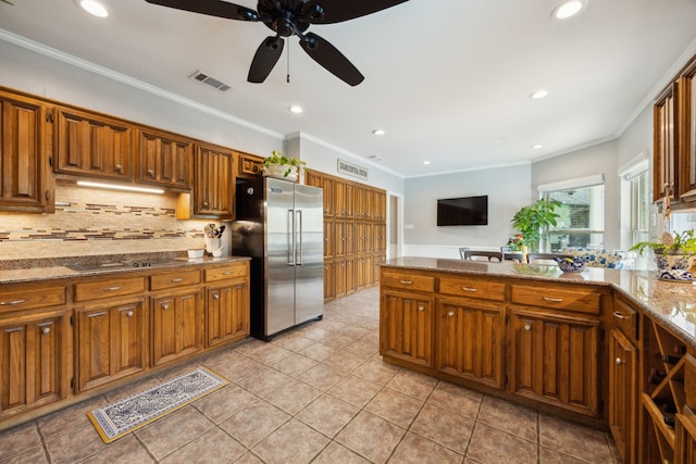 5835 Mapleshade Ln, Dallas, TX 75252 - kitchen featuring high end fridge, ceiling fan, backsplash, crown molding, and recessed lighting