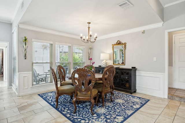 5835 Mapleshade Ln, Dallas, TX 75252 - dining room featuring a chandelier, a wainscoted wall, crown molding, and a decorative wall