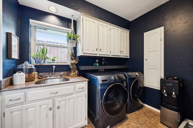 5835 Mapleshade Ln, Dallas, TX 75252 - laundry area with washer and dryer, cabinet space, and light tile patterned floors