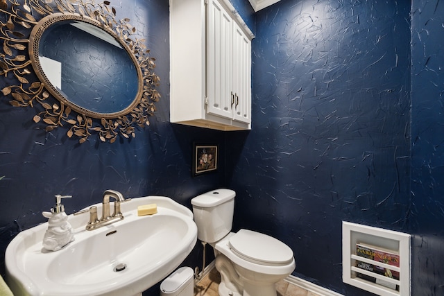 5835 Mapleshade Ln, Dallas, TX 75252 - half bathroom with a sink and toilet