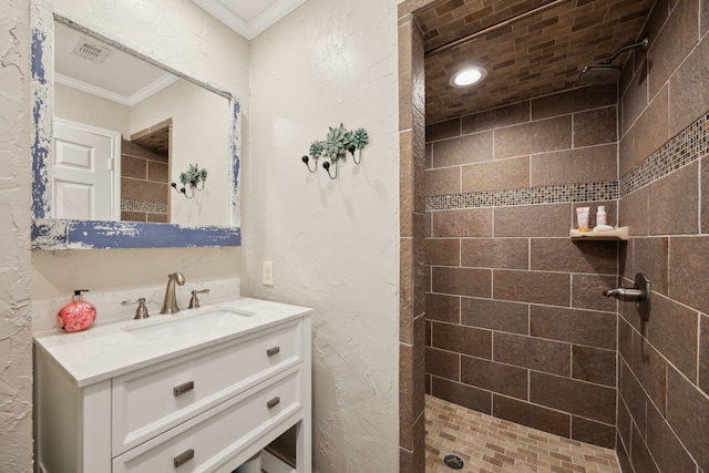 5835 Mapleshade Ln, Dallas, TX 75252 - bathroom featuring crown molding, a tile shower, and vanity
