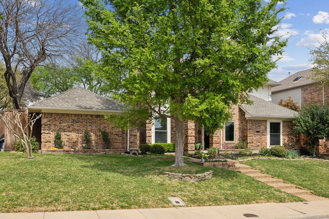 5835 Mapleshade Ln, Dallas, TX 75252 - view of property hidden behind natural elements with brick siding and roof with shingles