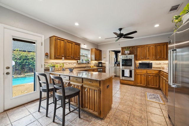 5835 Mapleshade Ln, Dallas, TX 75252 - kitchen featuring appliances with stainless steel finishes, a peninsula, tasteful backsplash, crown molding, and a sink