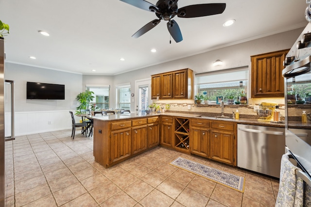 5835 Mapleshade Ln, Dallas, TX 75252 - kitchen with dishwasher, a sink, brown cabinets, ceiling fan, and a peninsula