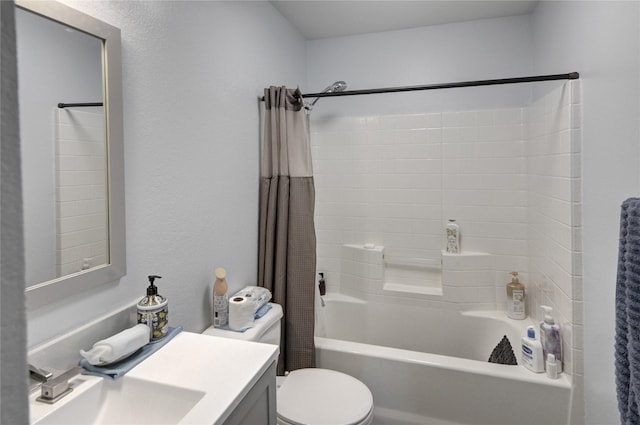 bathroom featuring toilet, vanity, and shower / bath combo with shower curtain
