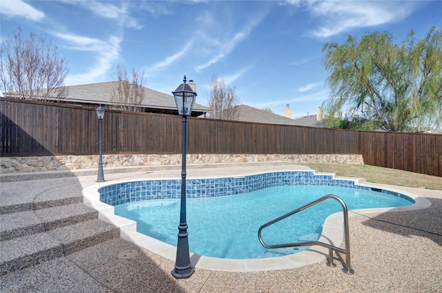 view of swimming pool with a fenced backyard and a fenced in pool