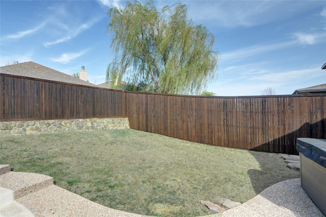 view of yard featuring a fenced backyard
