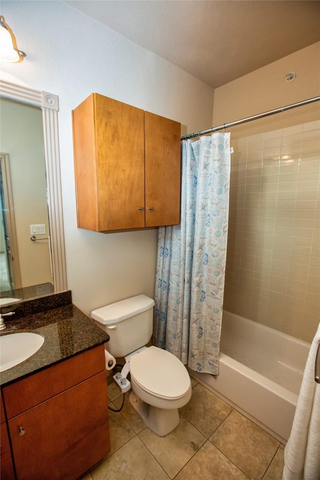 full bath with shower / bath combo, toilet, vanity, and tile patterned floors