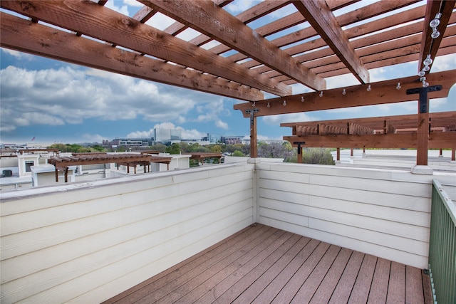 wooden deck featuring a pergola and a view of city