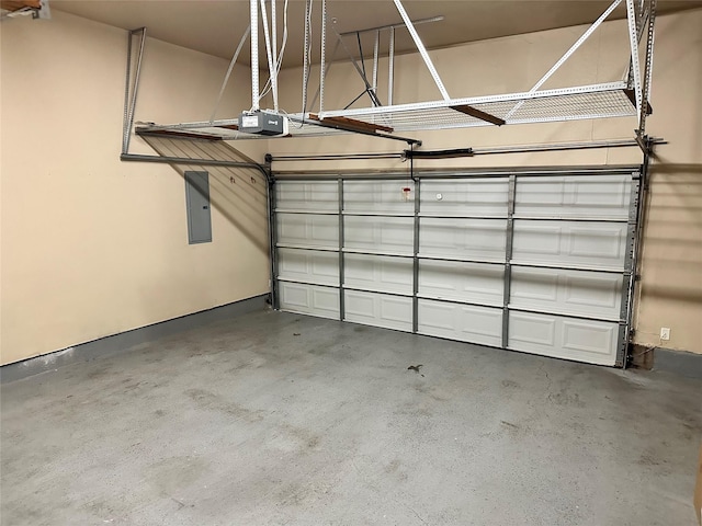 garage featuring electric panel and a garage door opener