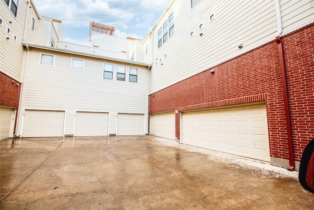 garage with concrete driveway