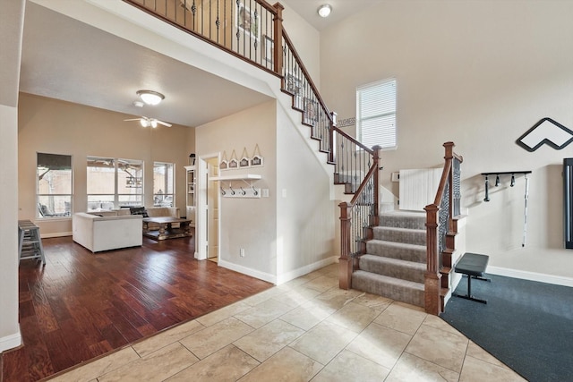 820 Clearlake Dr, Prosper, TX 75078 - stairs with ceiling fan, baseboards, and a high ceiling