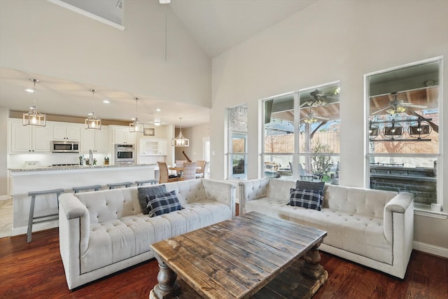820 Clearlake Dr, Prosper, TX 75078 - living room featuring dark wood finished floors, baseboards, high vaulted ceiling, and a ceiling fan