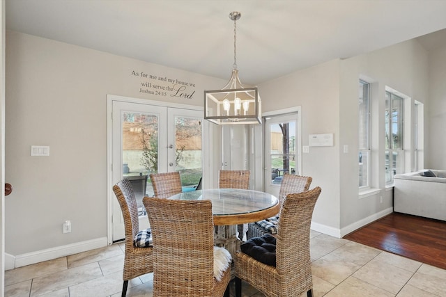 820 Clearlake Dr, Prosper, TX 75078 - dining area featuring french doors, a chandelier, light tile patterned flooring, and baseboards
