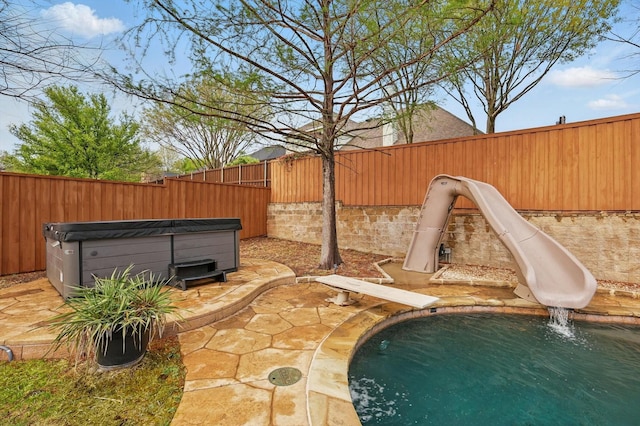 820 Clearlake Dr, Prosper, TX 75078 - view of pool with a hot tub, a fenced backyard, a water slide, and a patio area