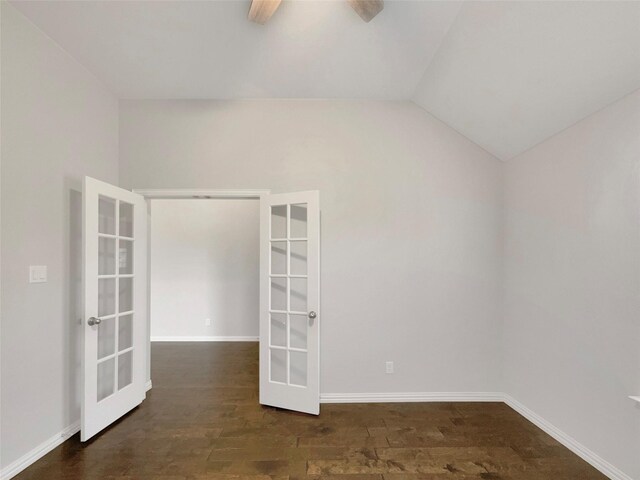 empty room with vaulted ceiling, french doors, baseboards, a ceiling fan, and wood finished floors