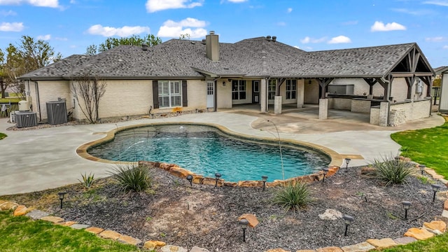 109 Meadow Glen Ct, Aledo, TX 76008 - back of property with area for grilling, brick siding, a patio, and a chimney