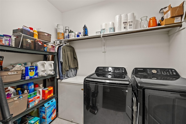laundry room with washing machine and clothes dryer and laundry area