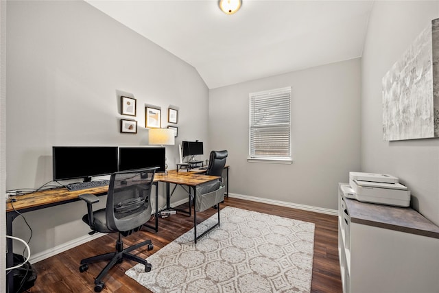 office space with dark wood finished floors, lofted ceiling, and baseboards