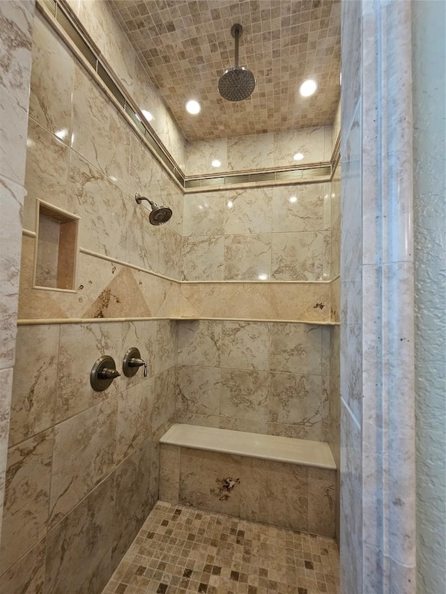 bathroom featuring tiled shower