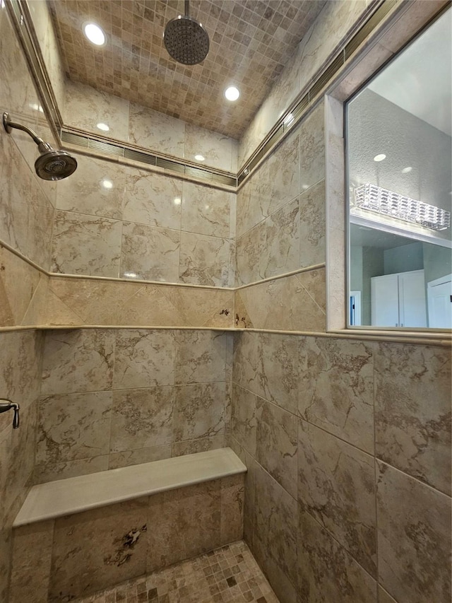 full bath with recessed lighting and a tile shower