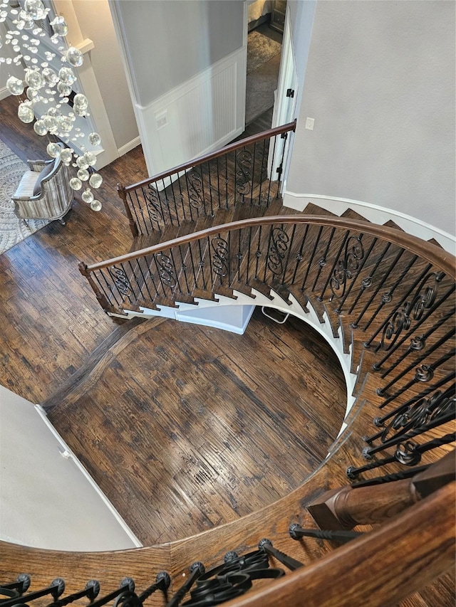 stairs featuring baseboards and wood finished floors