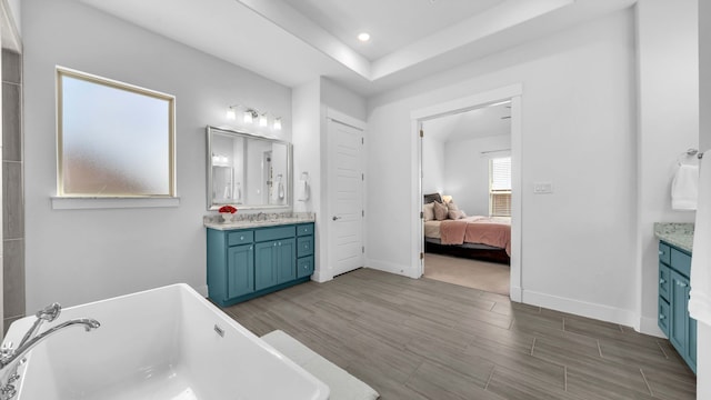1651 Wynne Ave, Prosper, TX 75078 - full bath featuring vanity, a soaking tub, wood finished floors, and recessed lighting