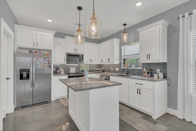 631 E Texas St, Denison, TX 75021 - kitchen with appliances with stainless steel finishes, decorative backsplash, white cabinets, and a sink