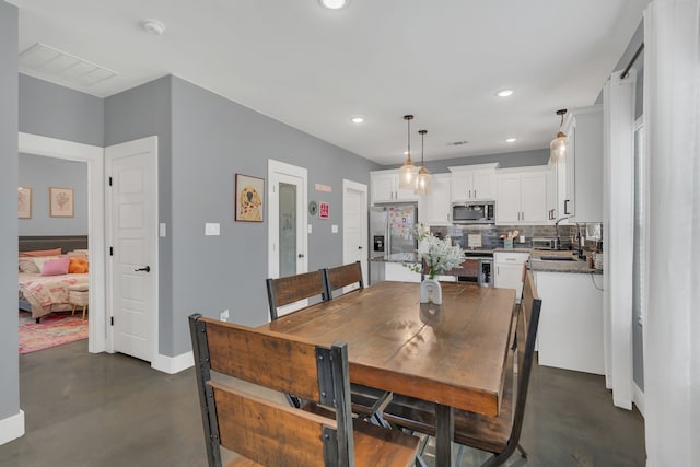 631 E Texas St, Denison, TX 75021 - dining space featuring visible vents, finished concrete floors, recessed lighting, and baseboards