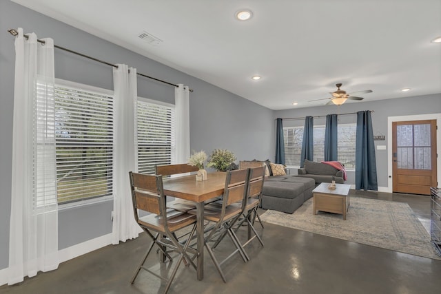 631 E Texas St, Denison, TX 75021 - dining area featuring baseboards, a ceiling fan, a wealth of natural light, and finished concrete flooring