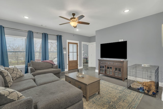 631 E Texas St, Denison, TX 75021 - living room featuring recessed lighting, a ceiling fan, finished concrete flooring, and baseboards