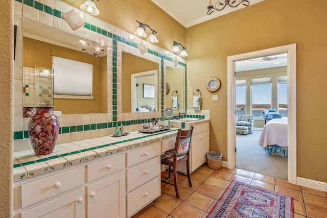 4204 Bluff View Dr, Granbury, TX 76048 - ensuite bathroom with baseboards, ornamental molding, tile patterned flooring, and vanity
