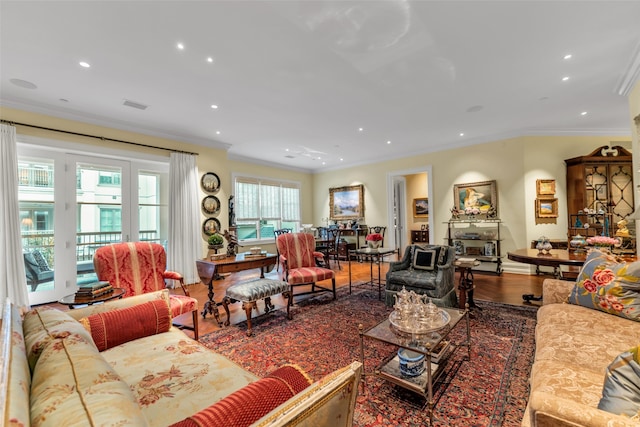 living room featuring recessed lighting, wood finished floors, and ornamental molding