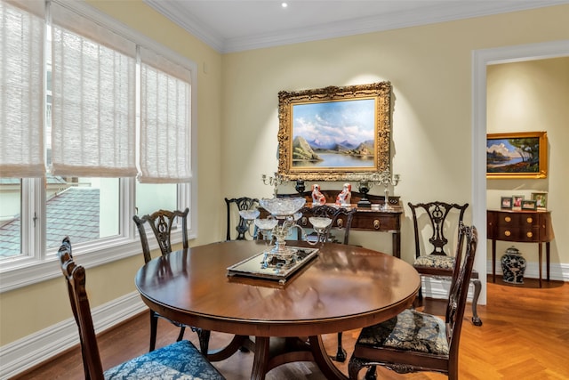 dining space with baseboards and ornamental molding