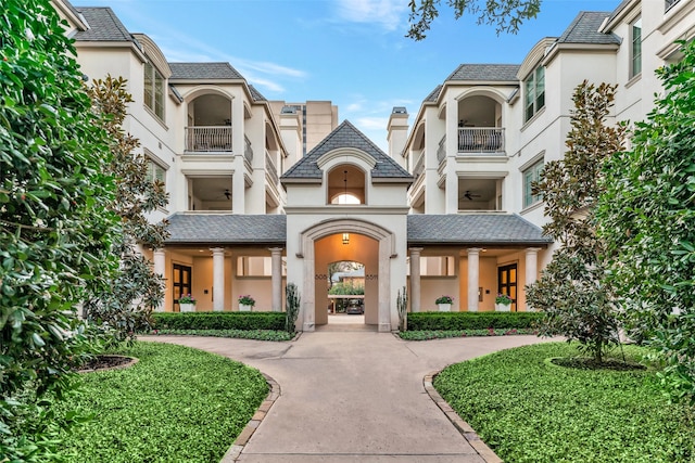 view of property with curved driveway
